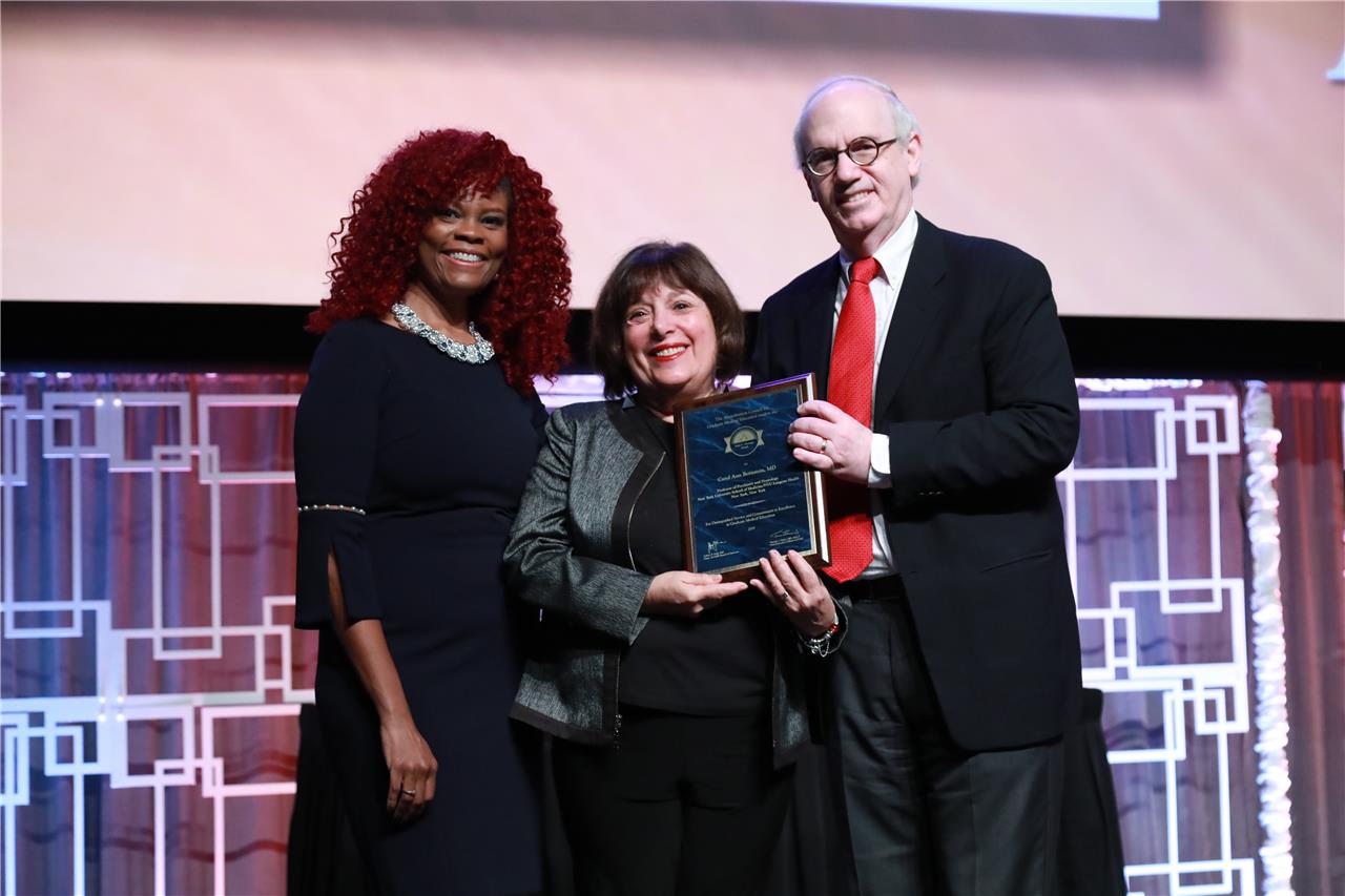2019 Gienapp Awardee Dr. Carol Bernstein is presented her award at the 2019 Annual Educational Conference