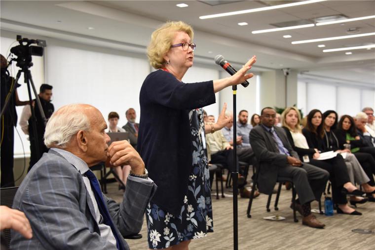 An audience member dialogues with Dr. Arno K. Kumagai during the Baldwin Seminar held June 26, 2019